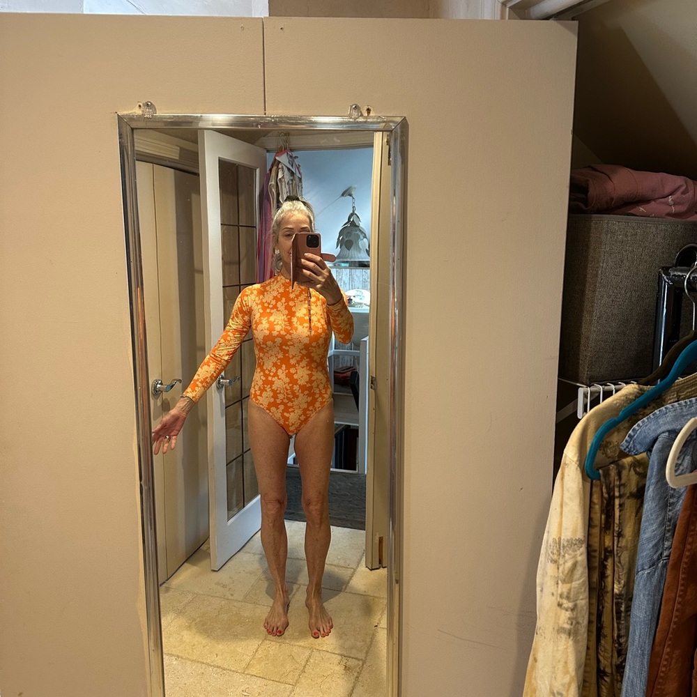 FP Movement by Free People Orange Floral One Piece long sleeve surf swimsuit.